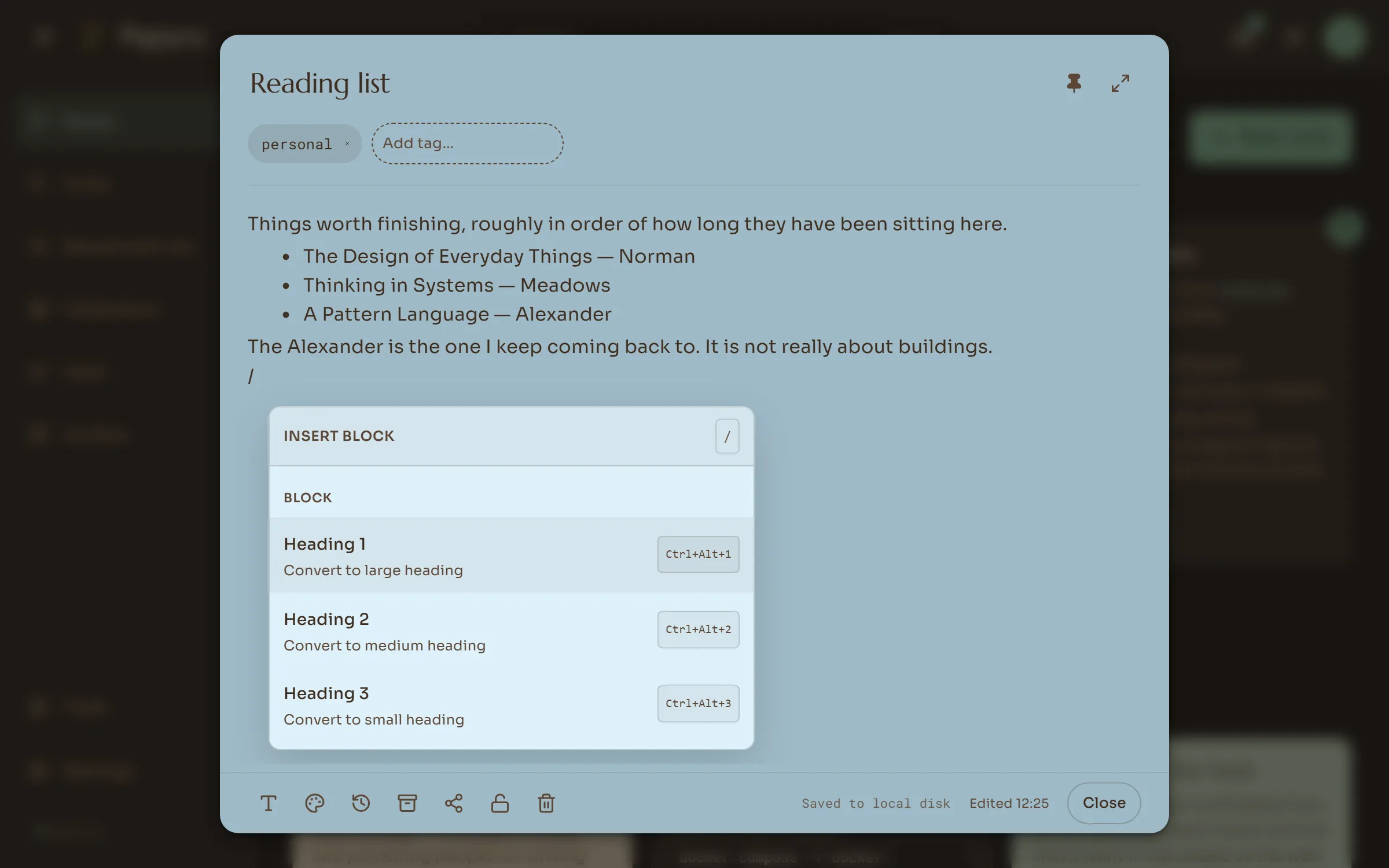 Typing / in a note opens a menu of headings, lists, tables, pictures and embeds