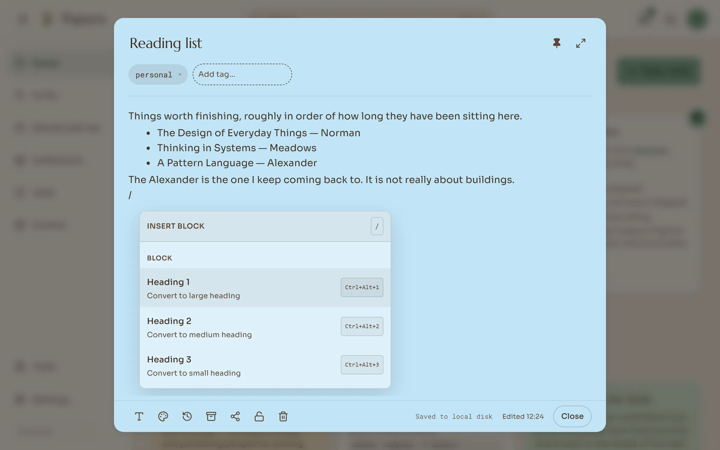 Typing / in a note opens a menu of headings, lists, tables, pictures and embeds